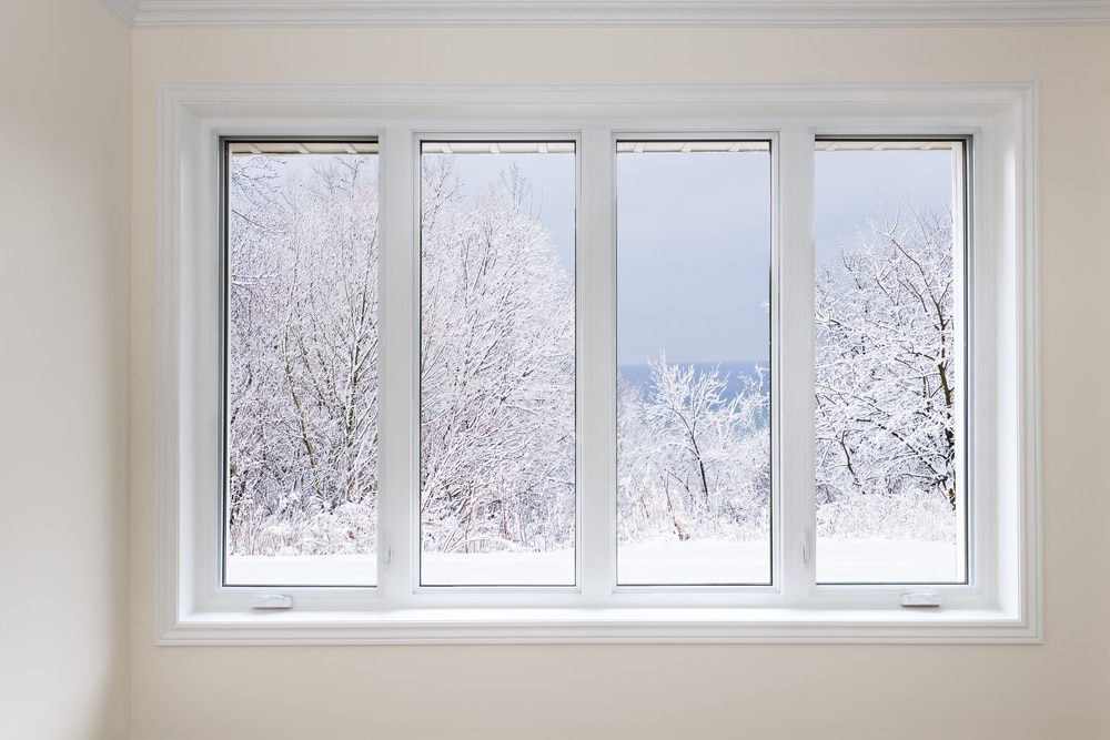 casement window looking out on winter scene