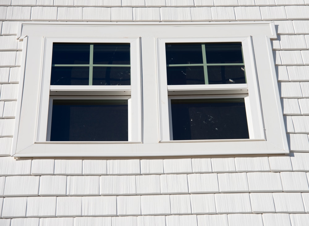 Double hung windows on white house