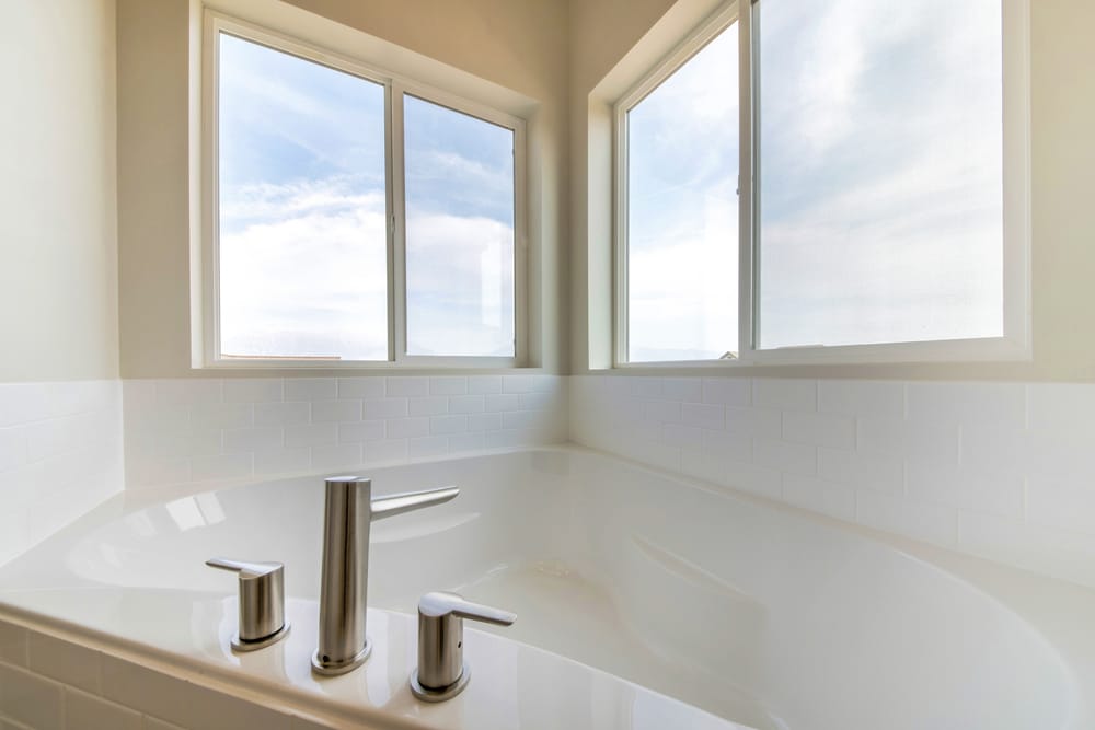 sliding windows above huge bathtub