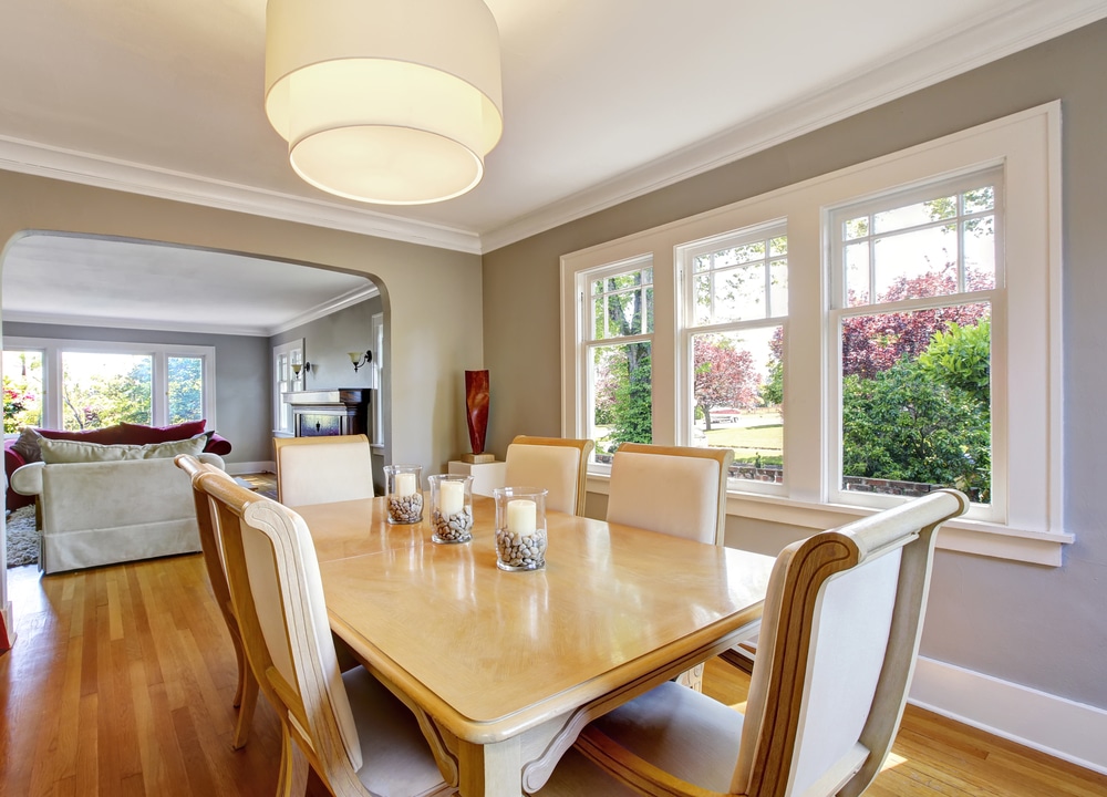 Open floor plan dining room with table set and hardwood floor.