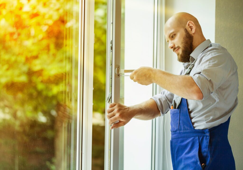 Contractor repairing glass door