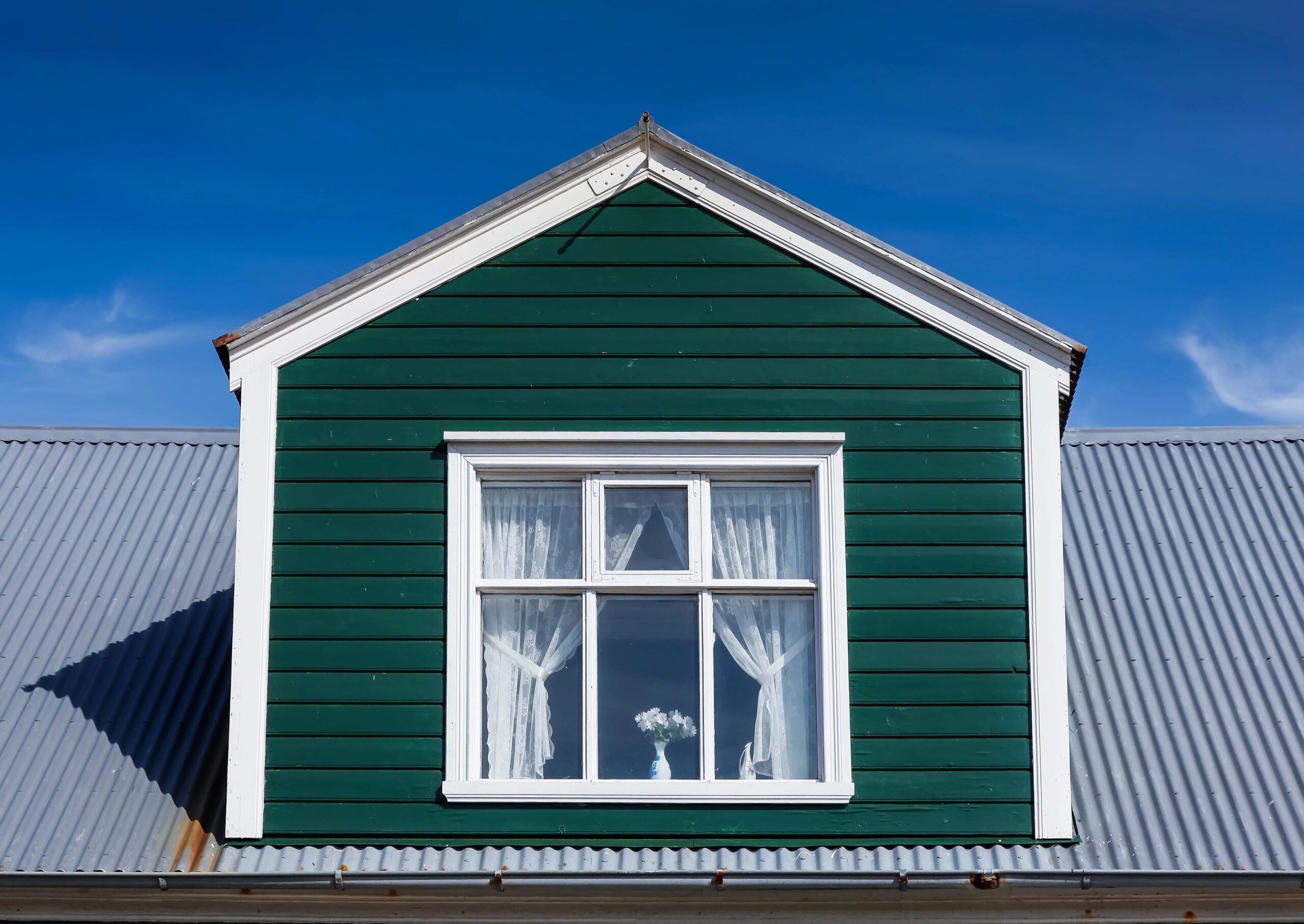 residential window on green dormer