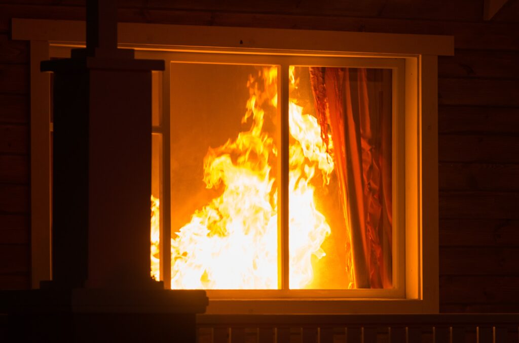 Flames seen through window
